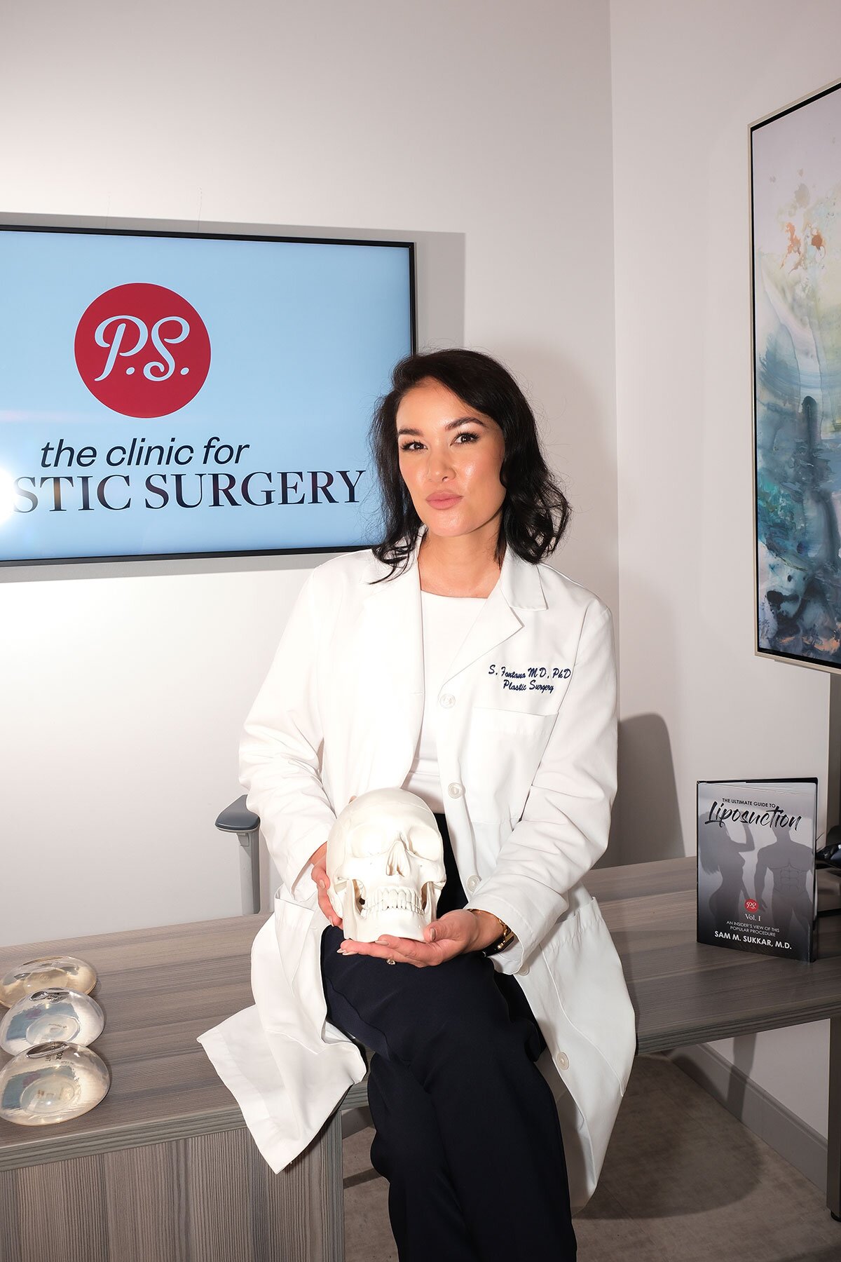 dr stefani fontana sitting on her desk in her office